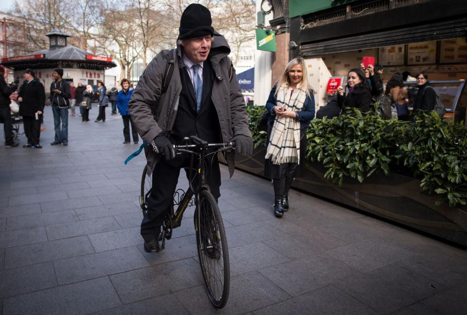 Mayor of London Boris Johnson on his bicycle as he leaves Global Radio studios in central London after presenting his regularly phone-in show for LBC radio following David Cameron comments that he is ruling out a third term as Prime Minister.