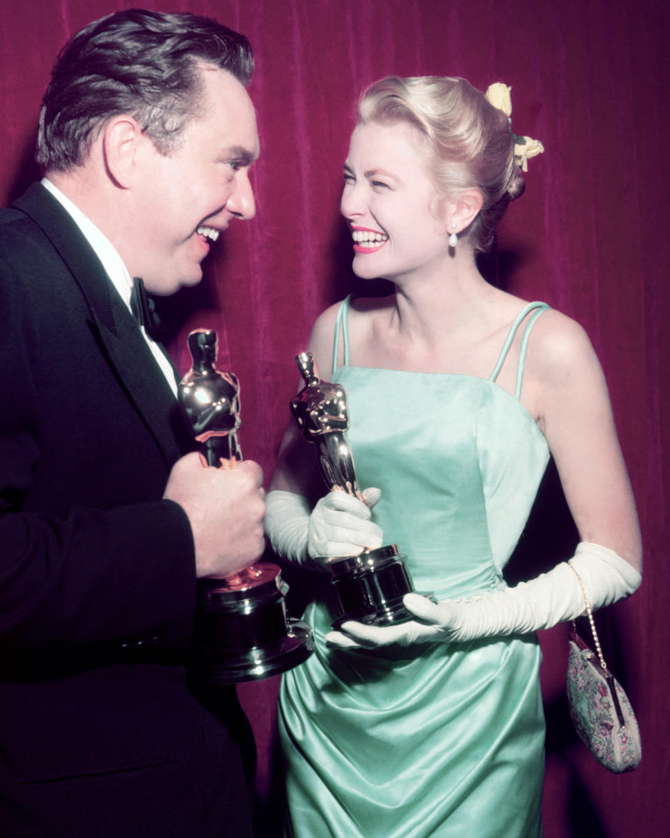 <p>Kelly accepted her 1955 Oscar for ‘The Country Girl’ wearing a gown originally created for the film’s premiere. Cut from a piece of $4,000 French satin, it was designed by American costume designer Edith Head. </p>