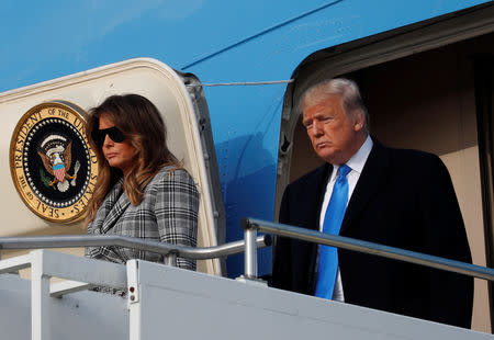 U.S. President Donald Trump and first lady Melania Trump exit Air Force One as they arrive at Pittsburgh International Airport prior to paying their respects in the wake of the shooting at the Tree of Life synagogue where 11 people were killed and six people were wounded in Pittsburgh, Pennsylvania, U.S., October 30, 2018. REUTERS/Kevin Lamarque