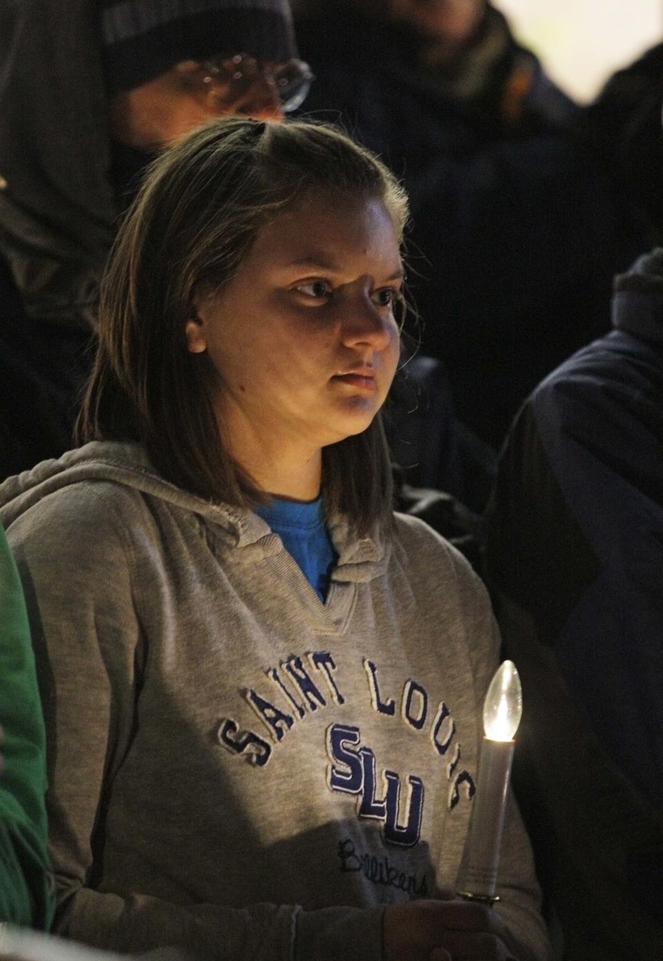 Jordyn Huston, a member of the Saint Louis University Students for Life group, attends a candlelight vigil for death row inmate Joseph Franklin on the steps of St. Francis Xavier Church in St. Louis