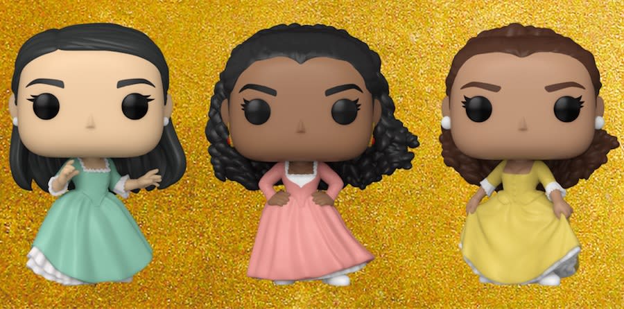 Three Funko Pops of the Schuyler sisters from the musical Hamilton, against a gold background