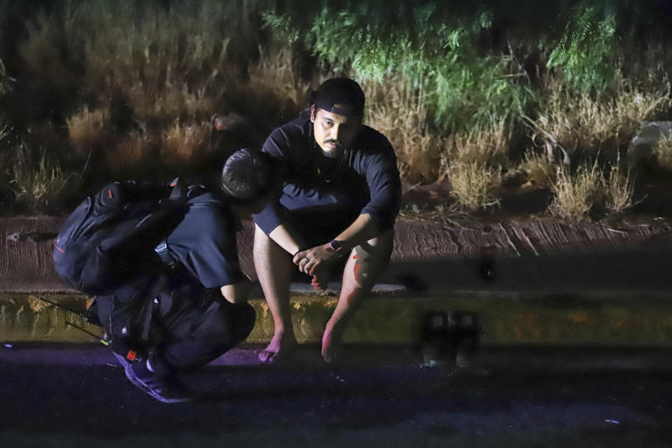 A relief worker tends to a man after a stage collapsed due to a gust of wind during an event attended by presidential candidate Jorge Álvarez Máynez in San Pedro Garza García, on the outskirts of Monterrey, Mexico, Wednesday, May 22, 2024. President Andres Manuel Lopez Obrador confirmed that four people were killed and at least a dozen injured. (AP Photo/Alberto Lopez)