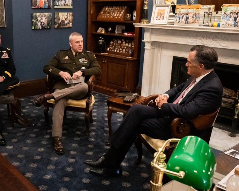 Major General Michael J. Turley sits next to U.S. Senator Mitt Romney.