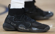 Houston Rockets guard Austin Rivers wears a pair of Adidas Crazy Eights with a tribute to Kobe Bryant written on the midsole in the second half of an NBA basketball game against the Denver Nuggets, Sunday, Jan. 26, 2020, in Denver. The Nuggets won 117-110. (AP Photo/David Zalubowski)