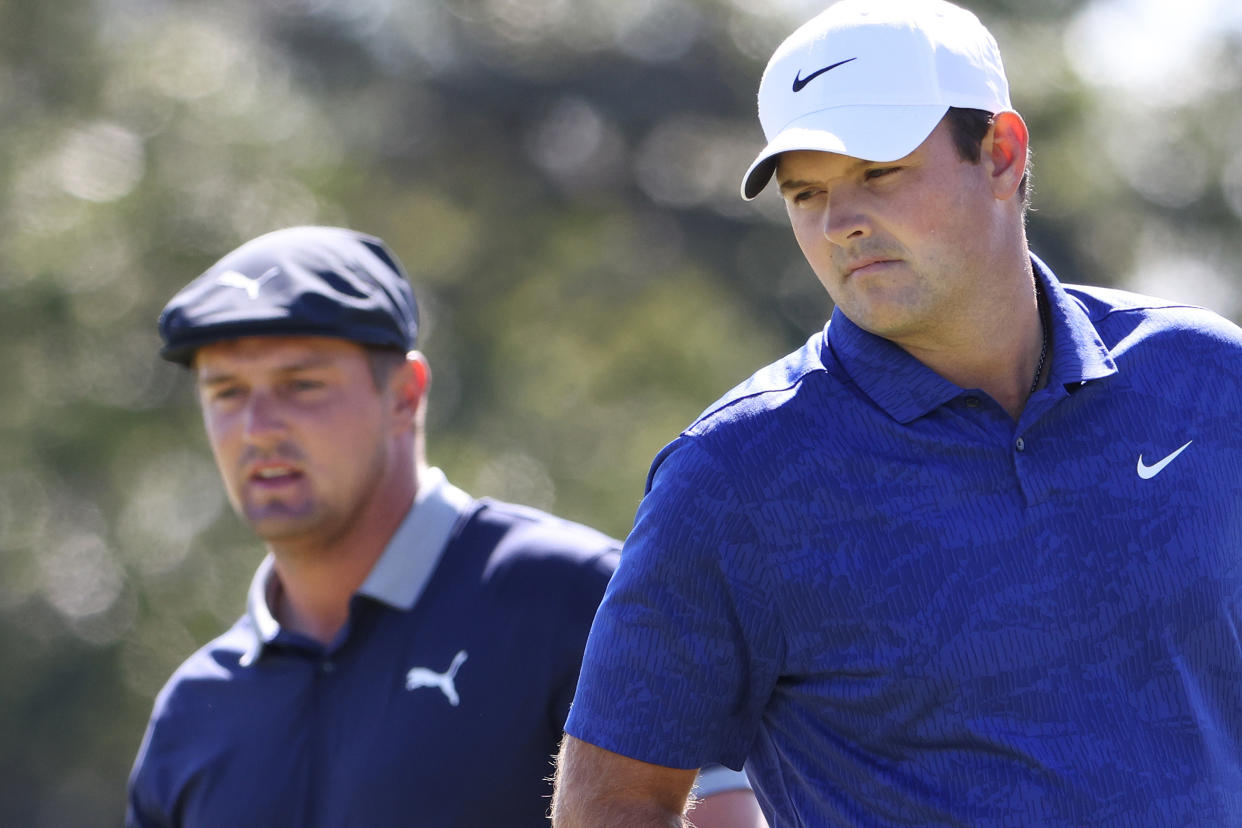 MAMARONECK, NEW YORK - SEPTEMBER 19: Bryson DeChambeau of the United States and Patrick Reed of the United States prepare to putt on the first green during the third round of the 120th U.S. Open Championship on September 19, 2020 at Winged Foot Golf Club in Mamaroneck, New York. (Photo by Jamie Squire/Getty Images)