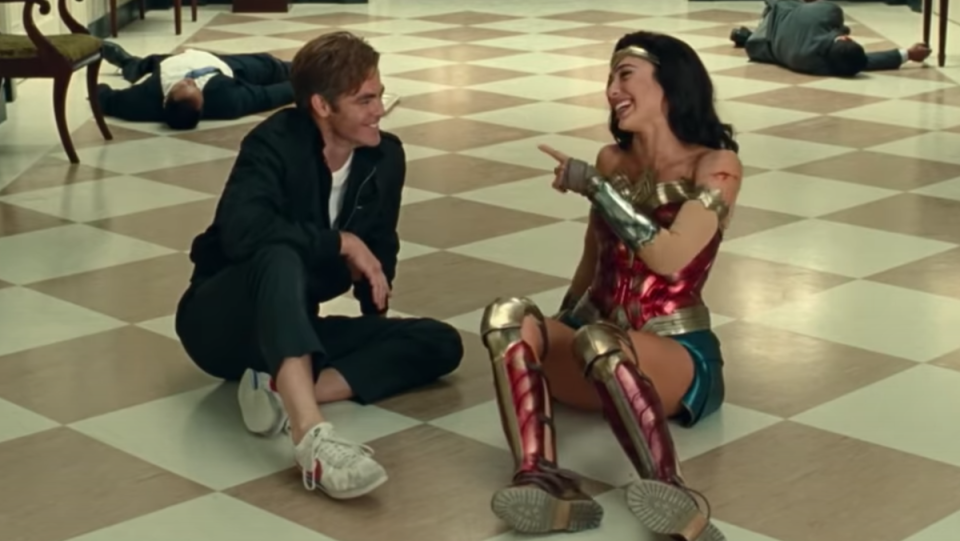 Chris Pine and Gal Gadot laugh on the floor in the Wonder Woman 1984 blooper reel.