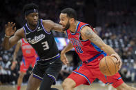 Detroit Pistons guard Cory Joseph (18) drives to the basket as Sacramento Kings guard Terence Davis (3) defends during the first quarter of an NBA basketball game in Sacramento, Calif., Wednesday, Jan. 19, 2022. (AP Photo/José Luis Villegas)