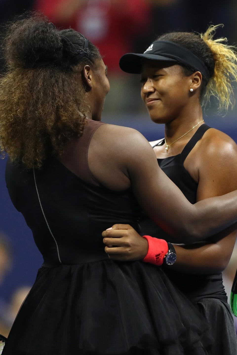 Serena Williams and Naomi Osaka embracing