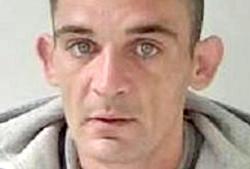 Paul Raymond, 41, was spotted wearing a stolen coat with the price tag still sticking out of the hood. (West Mercia Police/SWNS)