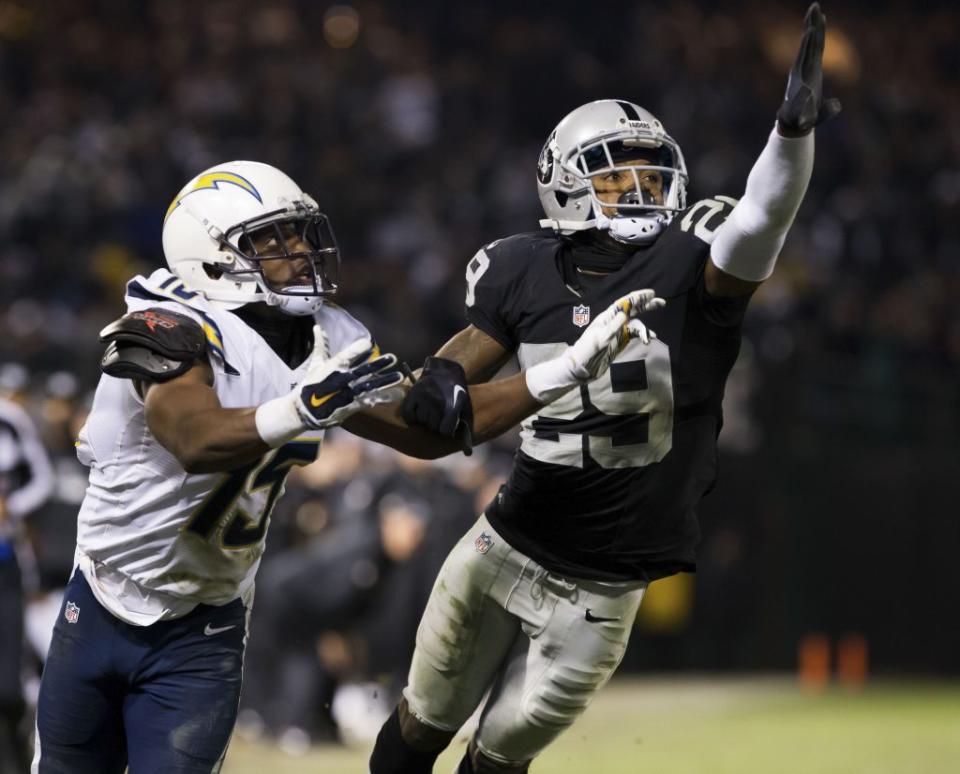 Dec 24, 2015; Oakland, CA, USA; Oakland Raiders cornerback David Amerson (29) prevents the pass intended for San Diego Chargers wide receiver Dontrelle Inman (15) during the fourth quarter at O.co Coliseum. The Oakland Raiders defeated the San Diego Chargers 23-20. Mandatory Credit: Kelley L Cox-USA TODAY Sports