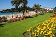 <p>St Brelade's Bay Beach on the island of Jersey is renowned for its elegant green-railinged boardwalk and famous restaurant, Oyster Box.</p><p><a class="link " href="https://www.booking.com/" rel="nofollow noopener" target="_blank" data-ylk="slk:FIND ACCOMMODATION;elm:context_link;itc:0;sec:content-canvas">FIND ACCOMMODATION </a></p>