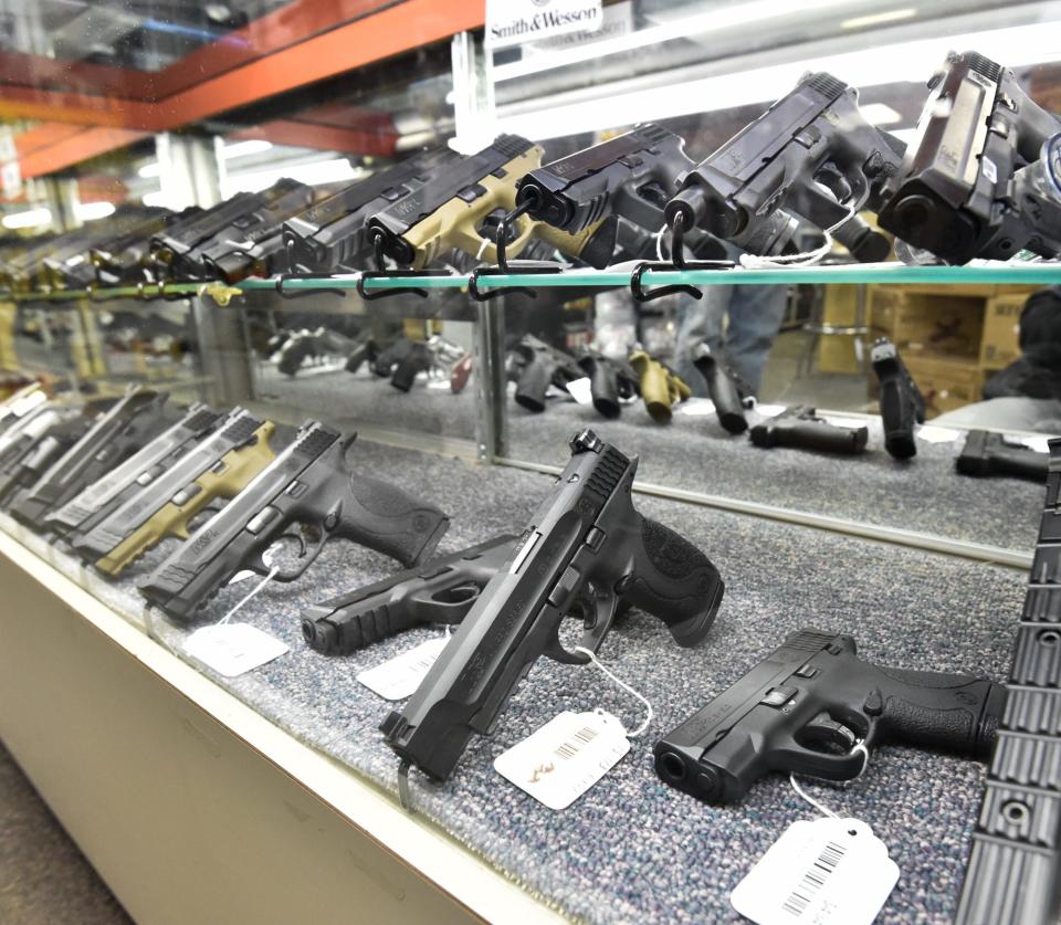 Handguns for sale are displayed at Shooter's Choice in Dover.