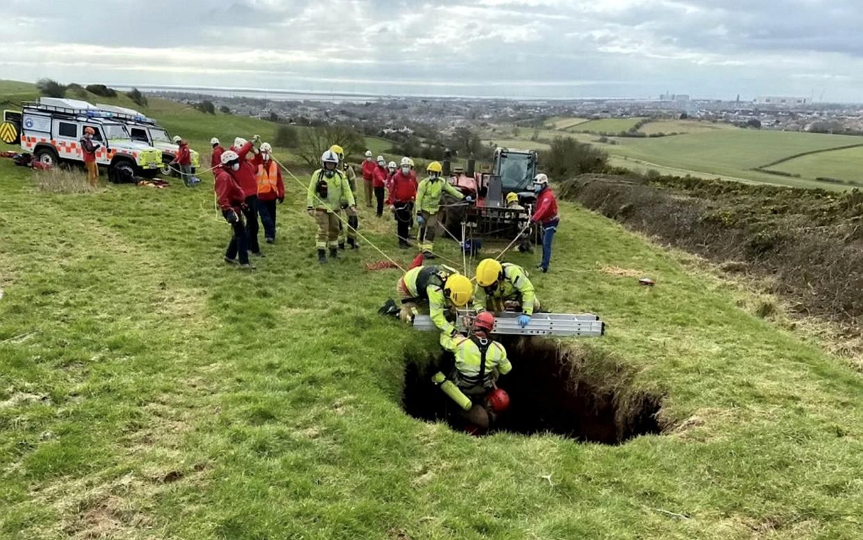 A farmer found himself at the centre of a dramatic rescue operation yesterday after being swallowed by a sinkhole - Cumbria Fire & Rescue / SWNS