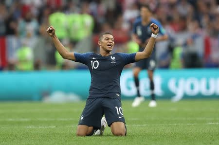 France's Kylian Mbappe celebrates winning the World Cup. REUTERS/Carl Recine