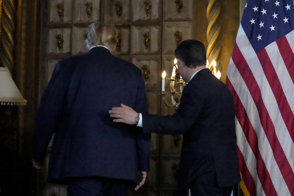 Republican presidential candidate former President Donald Trump, left, and Speaker of the House Mike Johnson, R-La., depart after a news conference, Friday, April 12, 2024, at Mar-a-Lago in Palm Beach, Fla. (AP Photo/Wilfredo Lee)