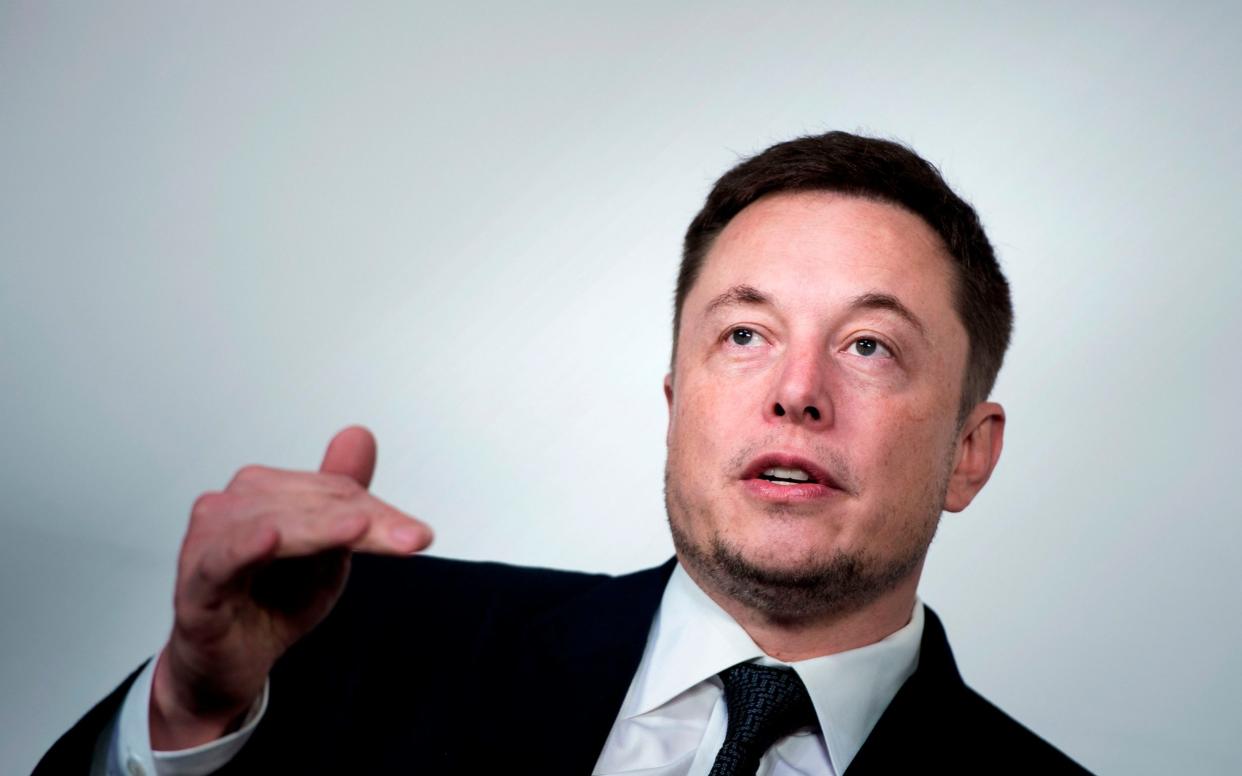 Elon Musk built a submarine to try and get the boys and their coach out of the cave - AFP