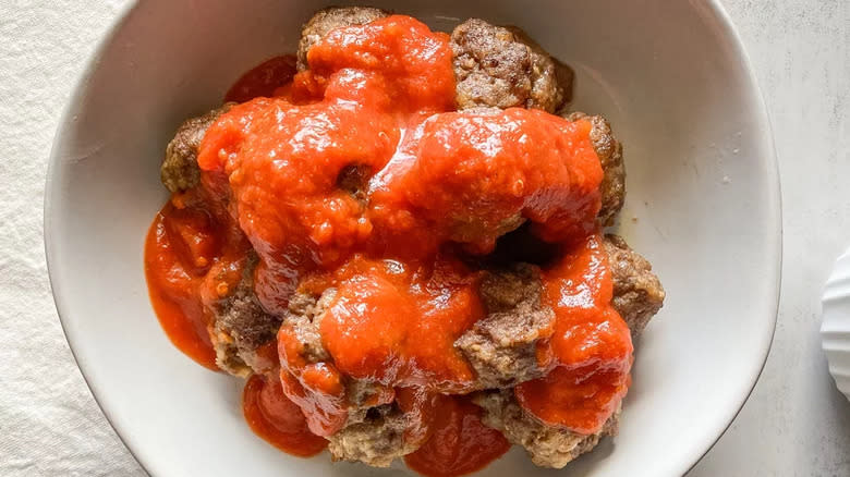 Meatballs covered in tomato sauce