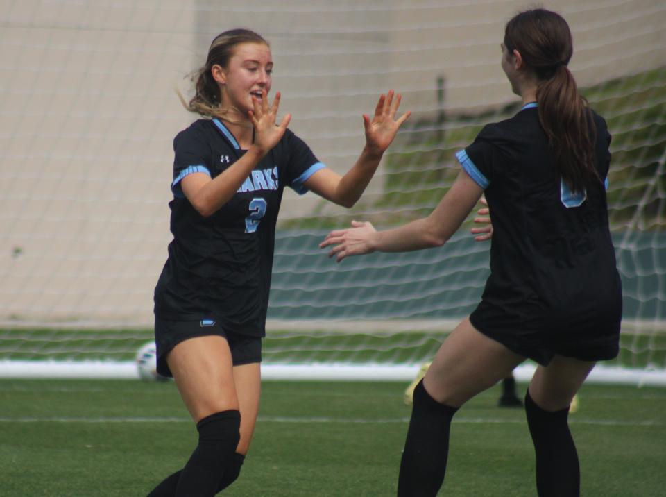 Ponte Vedra forward Natalie Brooks (2) is congratulated by teammate Natalie McCann (6) after scoring against St. Thomas Aquinas in the state semifinals.