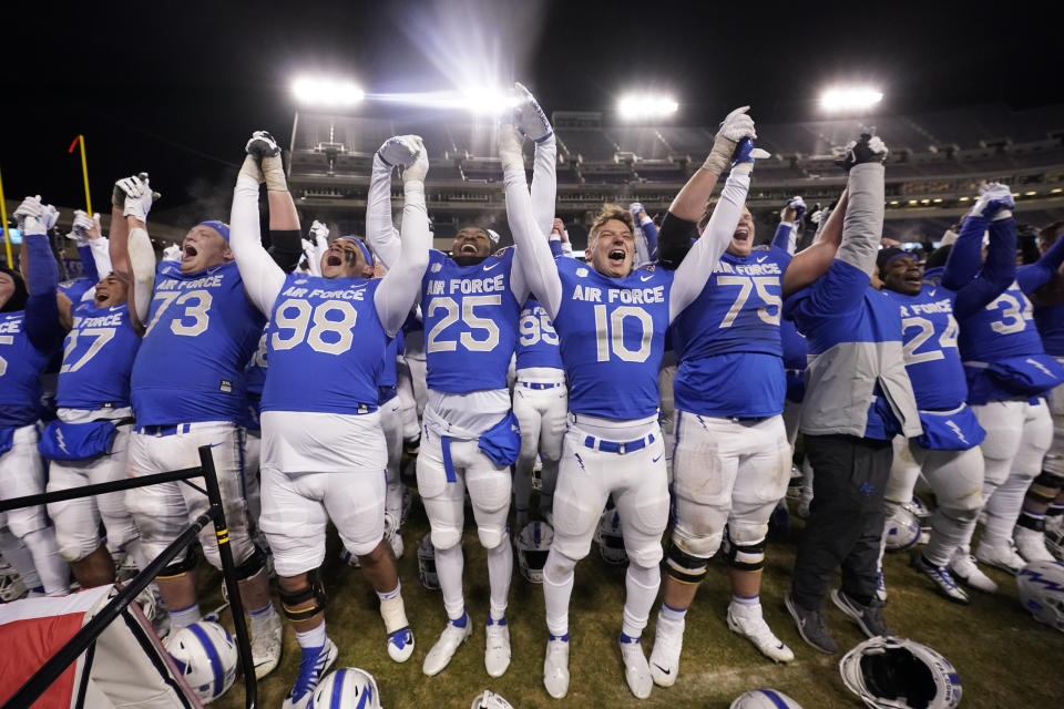 Air Force players raise their arms after a 30-15 win over Baylor in the Armed Forces Bowl NCAA college football game in Fort Worth, Texas, Thursday, Dec. 22, 2022. (AP Photo/LM Otero)
