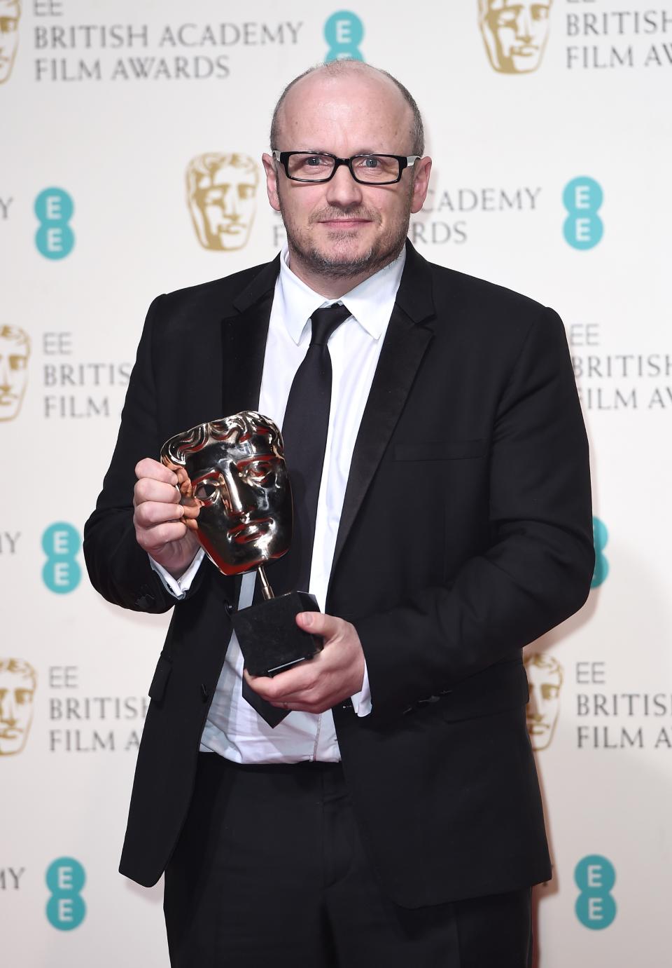 Lenny Abrahamson, accepting the Best Actress award on behalf of Brie Larson for ‘Room’ poses in the winners room at the EE British Academy Film Awards on February 14, 2016 in London, England. (Photo by Ian Gavan/Getty Images)