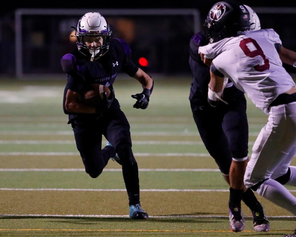 Mission Oak's Cameron Azevedo heads for a first down and sealed victory against Rio Hondo Prep during their CIF State South Division 4-A Football Championship Regional Bowl Game in Tulare, Calif., Saturday, Dec. 2, 2023. Mission Oak won the game 29-14.