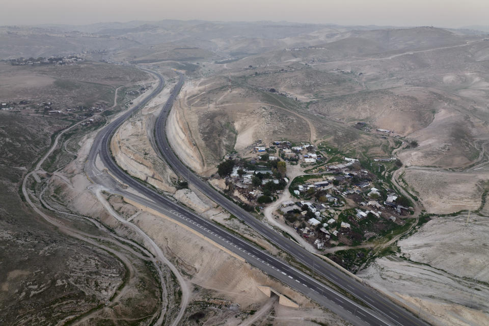 A view of the Bedouin hamlet of Khan al-Ahmar in the West Bank, Tuesday, Jan. 24, 2023. The long-running dispute over the West Bank Bedouin community of Khan al-Ahmar, which lost its last legal protection against demolition four years ago, resurfaced this week as a focus of the frozen Israeli-Palestinian conflict. Israel's new far-right ministers vow to evacuate the village as part of a wider project to expand Israeli presence in the 60% of the West Bank over which the military has full control. Palestinians seek that land for a future state. (AP Photo/Oded Balilty)