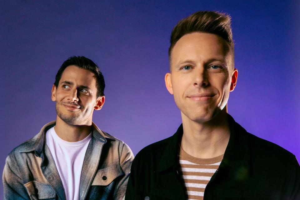 Benj Pasek looks to the side as Justin Paul faces the camera for a portrait.