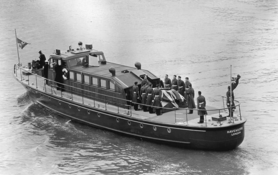 Winston Churchill's coffin is carried on board the barge Havengore at Tower Pier 30 Jan 1965