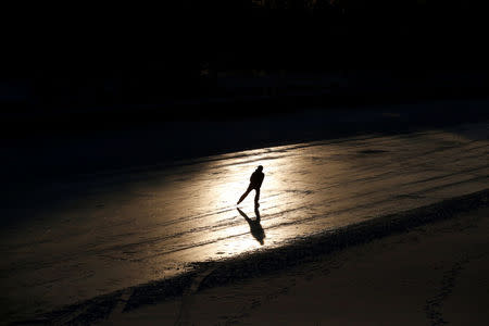 A person skates on the Rideau Canal, with the temperature at about minus 24 degrees Celsius, in Ottawa, Ontario, Canada January 5, 2018. REUTERS/Chris Wattie