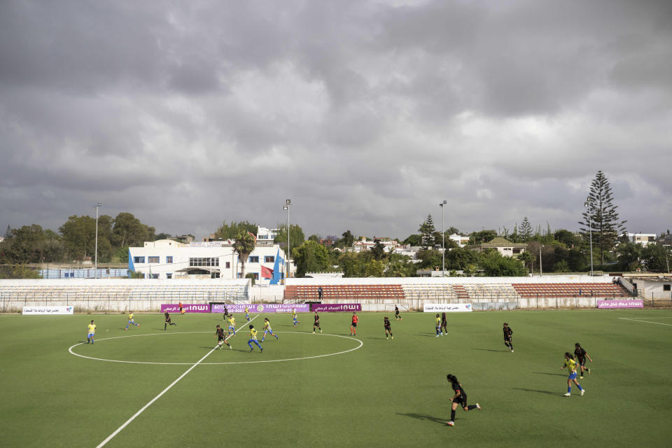 Women footballers compete in a soccer match between ASFAR and ASDCT Ain Atiq, in Morocco's professional women league, in Rabat, Morocco, Wednesday, May 17, 2023. (AP Photo/Mosa'ab Elshamy)