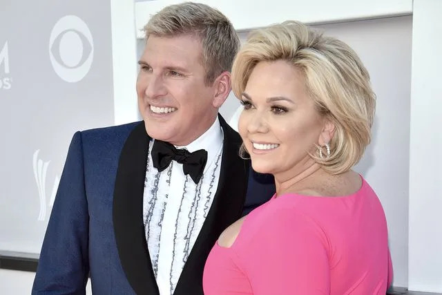 Kevin Mazur/ACMA2017/Getty (L-R) Todd Chrisley and Julie Chrisley attend the 52nd Academy Of Country Music Awards at Toshiba Plaza on April 2, 2017 in Las Vegas, Nevada.