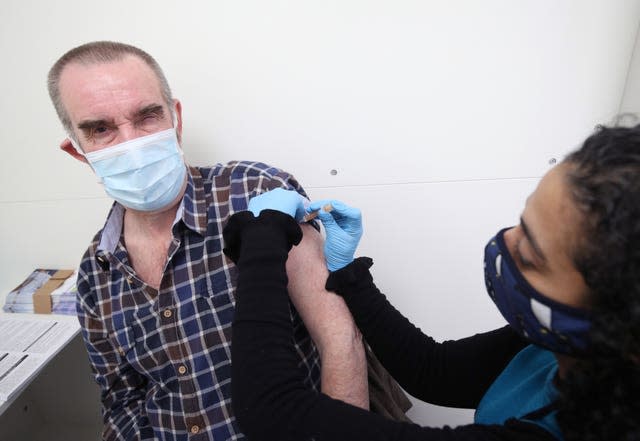 Pharmacist Asha Fowells vaccinates Barrie Reader, aged 74, with his first dose of the Oxford/AstraZeneca coronavirus vaccine, at Copes Pharmacy and Travel Clinic in Streatham, south London (Yui Mok/PA)