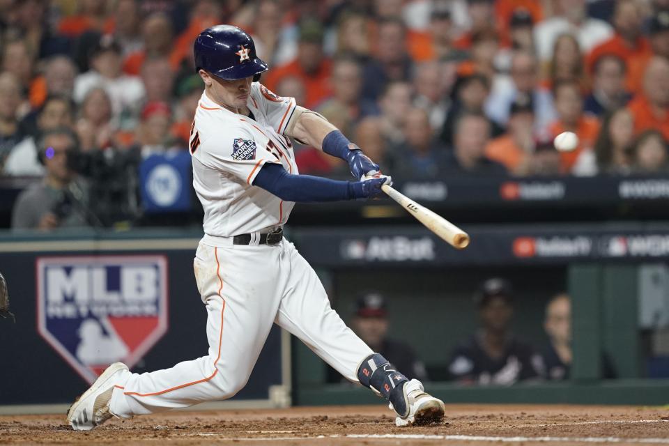 Houston Astros' Alex Bregman hits a two-run home run during the first inning of Game 2 of the baseball World Series against the Washington Nationals Wednesday, Oct. 23, 2019, in Houston. (AP Photo/Eric Gay)