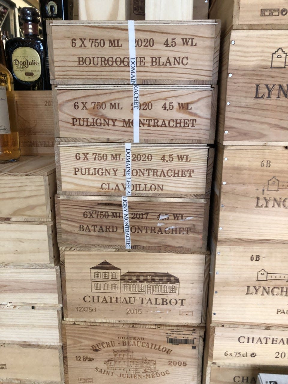 Hamptons has banded wooden crates of Assorted wines from Burgundy and Bordeaux.