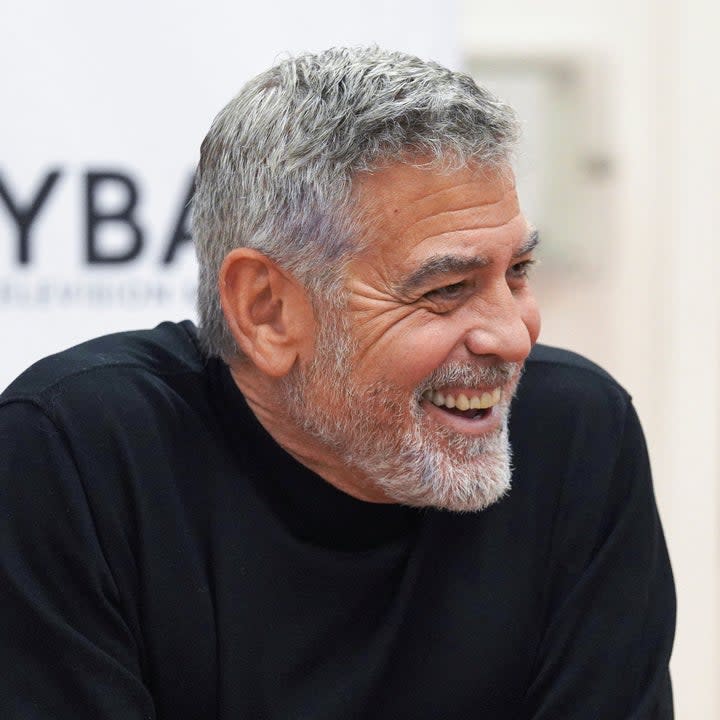 George Clooney smiling at a news conference