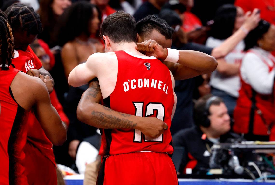 N.C. State’s DJ Horne (0) hugs Michael O’Connell (12) as time runs down in N.C. State’s 84-76 victory over UNC in the championship game of the 2024 ACC Men’s Basketball Tournament at Capital One Arena in Washington, D.C., Saturday, March 16, 2024.