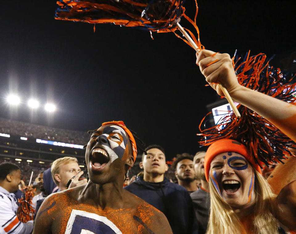 Auburn fans were delighted enough to rush their home field after the Tigers defeated rival Alabama 26-14 in the Iron Bowl. (AP)