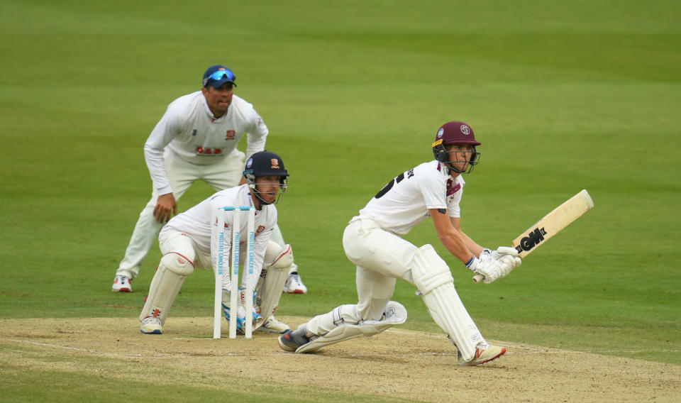 Tom Lammonby plays a shot as Adam Wheater and Sir Alastair Cook look onGetty