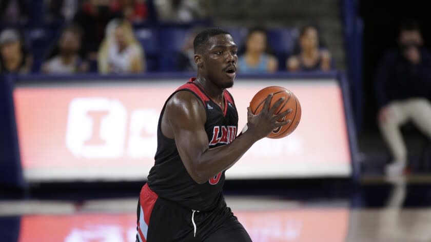 Loyola Marymount guard Eli Scott handles the ball during the second half of an NCAA college basketball game against Gonzaga in Spokane, Wash., Saturday, Feb. 27, 2021. (AP Photo/Young Kwak)