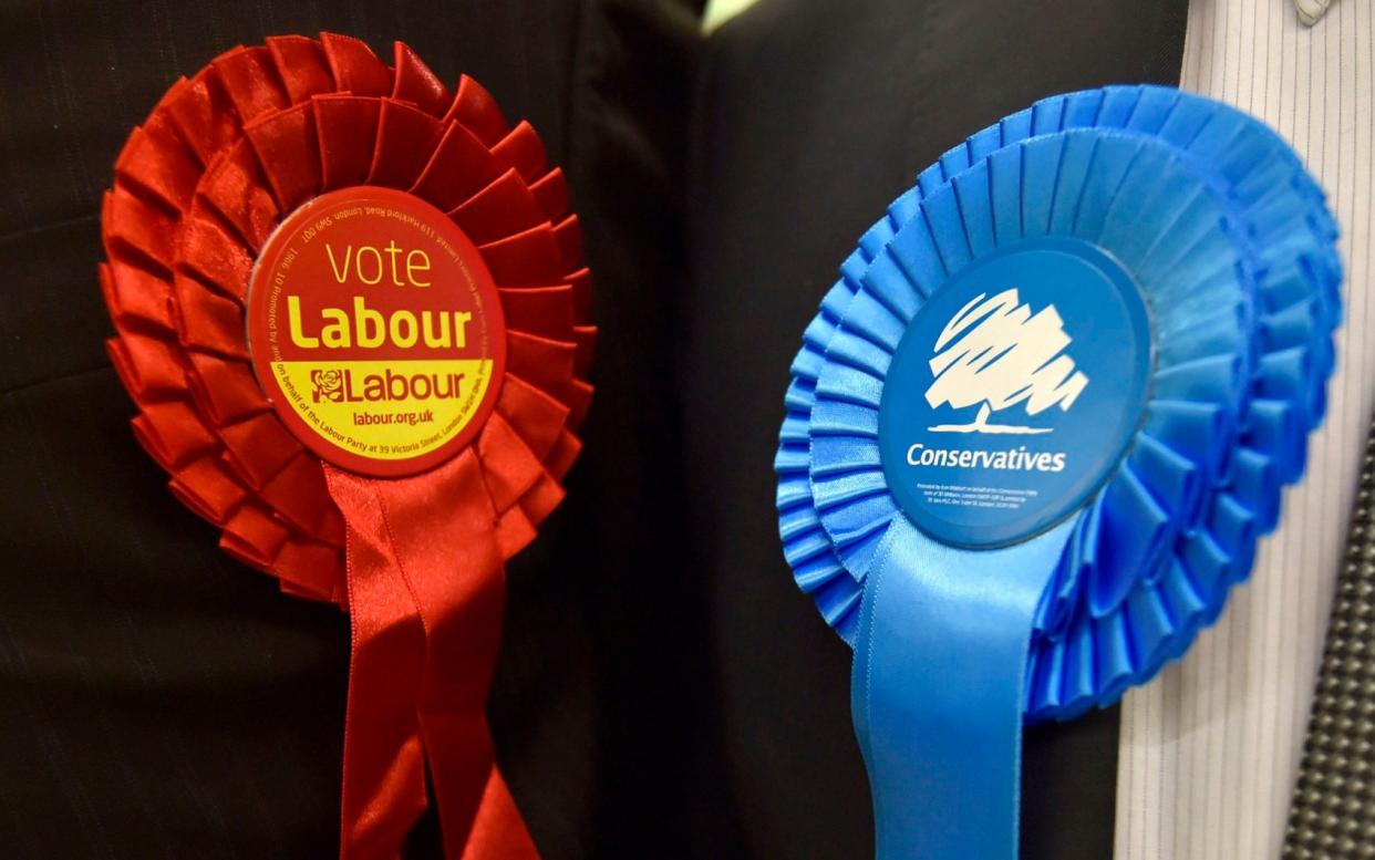 File photo dated 06/05/16 of Conservative Party and Labour Party rosettes, as figures from the Electoral Commission show that the Labour Party spent £15 million more than the Conservatives last year. PRESS ASSOCIATION Photo. Issue date: Thursday August 31, 2017. Accounts for Jeremy Corbyn's party show it took in £49,840,000 and spent £43,324,000 nationally in 2016. See PA story POLITICS Accounts. Photo credit should read: Hannah McKay/PA Wire - Hannah McKay/PA Wire