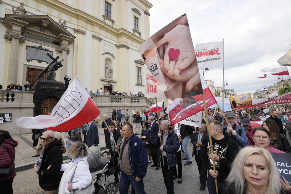 Anti-abortion demonstrators march in support of every conceived life and against steps taken by the new government to liberalize Poland's strict law and allow termination of pregnancy until the 12th week, in Warsaw, Poland, on Sunday, April 14, 2024. Last week, Poland's parliament, which is dominated by the liberal and pro-European Union ruling coalition, voted to approve further detailed work on four proposals to lift the near-ban on abortions. (AP Photo/Czarek Sokolowski)