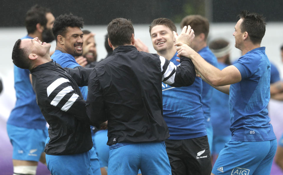 All Blacks players from left, Ryan Crotty, Ardie Savea, Beauden Barrett and Ben Smith react during a training session in Tokyo, Japan, Tuesday, Oct. 22, 2019. The All Blacks play England in a Rugby World Cup semifinal in Yokohama on Saturday Oct. 26. (AP Photo/Mark Baker)