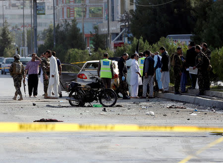 Afghan security forces inspect the site of a suicide attack in Kabul, Afghanistan September 9, 2018.REUTERS/Omar Sobhani