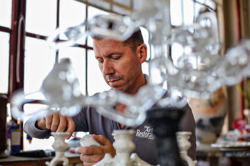 Los Angeles, CA - July 14: Henri Laborde an art restorer works in his DTLA studio on Friday, July 14, 2023 in Los Angeles, CA. (Jason Armond / Los Angeles Times)