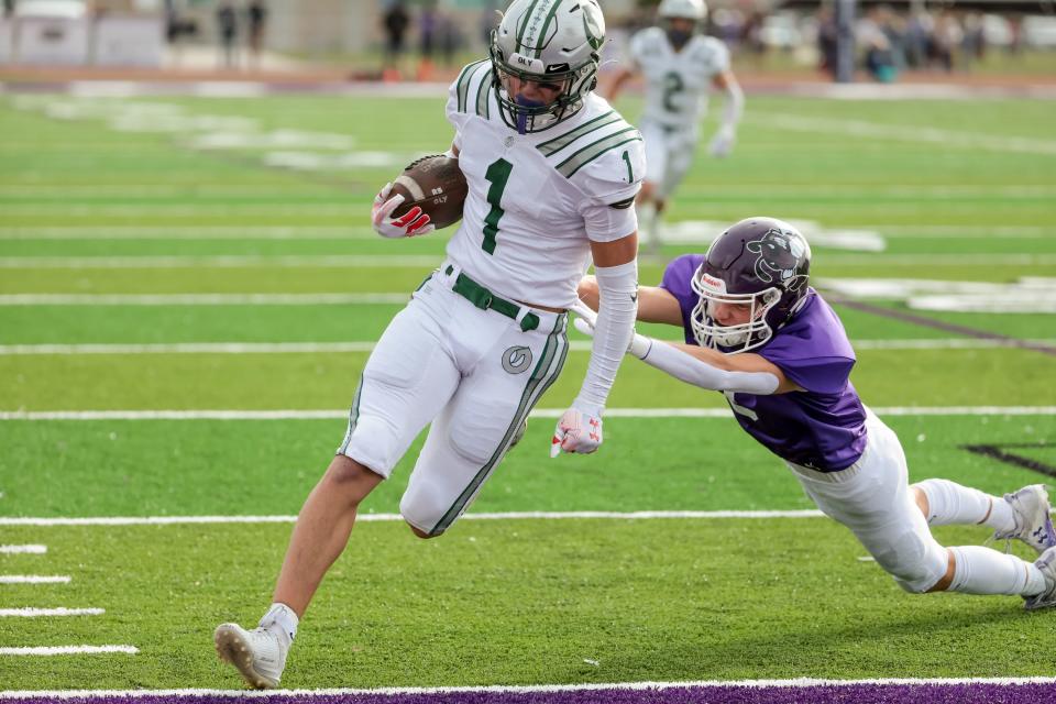 Olympus’ Luke Bryant scores a touchdown in a 5A quarterfinal high school football game against Box Elder in Brigham City on Friday, Nov. 3, 2023. | Spenser Heaps, Deseret News