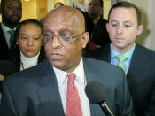 FILE - In a Tuesday, April 2, 2019 file photo, acting Baltimore Mayor Jack Young talks to reporters after meeting with state senators who represent Baltimore in Annapolis. When Bernard “Jack” Young automatically became Baltimore’s acting mayor on April 1, he emphasized that he’d act only as a “placeholder” for the embattled elected mayor. But it’s been more than three weeks since Mayor Catherine Pugh slipped out of sight on an indefinite leave of absence, and it appears Young is settling in for a lengthy stint as Baltimore’s No. 1 official. (AP Photo/Brian Witte, File)