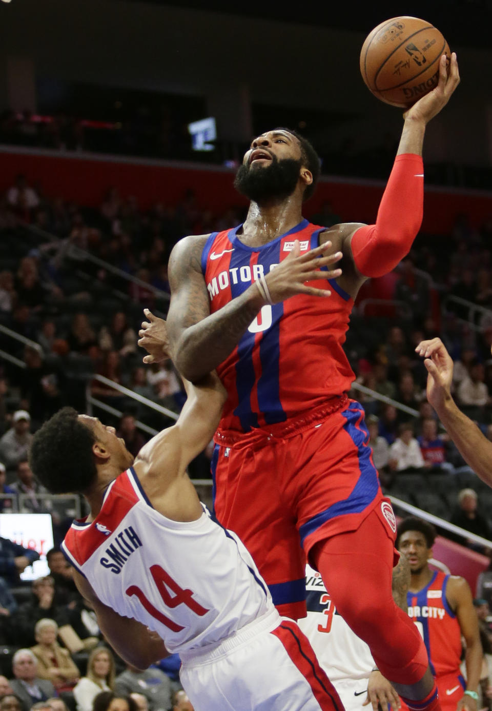 Detroit Pistons center Andre Drummond (0) shoots against Washington Wizards guard Ish Smith (14) during the first half of an NBA basketball game Thursday, Dec. 26, 2019, in Detroit. (AP Photo/Duane Burleson)