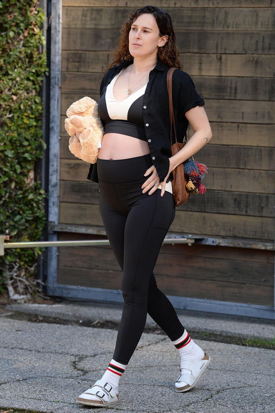 Rumer Willis leaving a workout class, carrying her new Warmies while showing off her baby bump wearing sustainable brand Losano