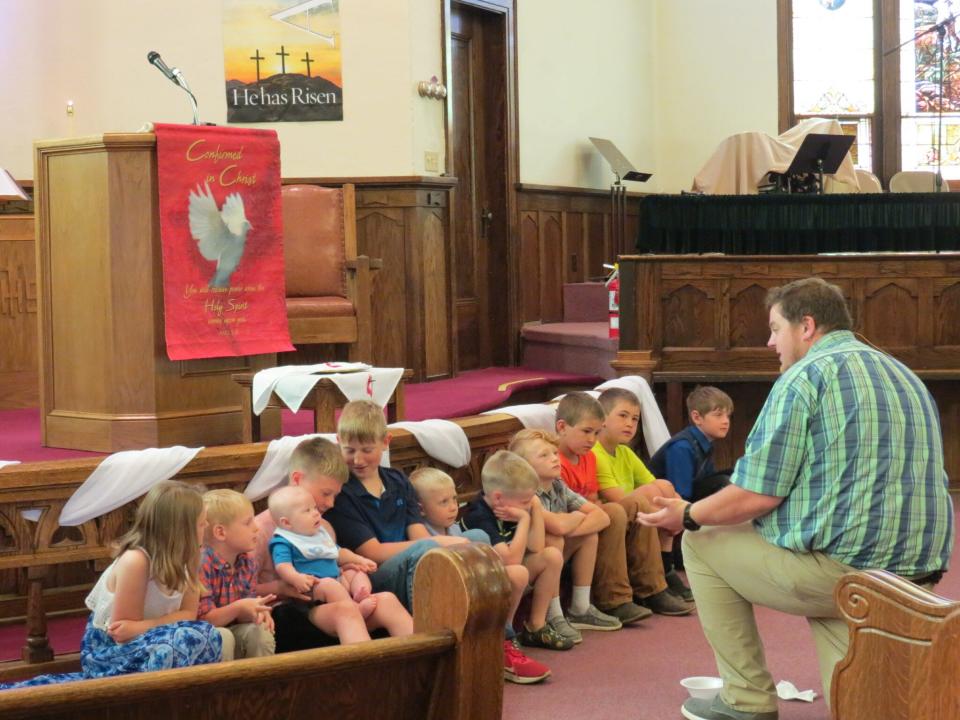 Connecting with children and young adults is seen as an important way to grow church membership in the future. Here, Pastor Zach Kingery teaches Scripture to children at the United Methodist Church of Wessington Springs during a "Young Disciples Moment" earlier this year.