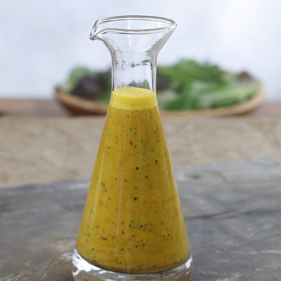 <p>Sweet raisins, honey and carrot juice balance the heat of crushed red pepper in this brightly colored vinaigrette.</p>